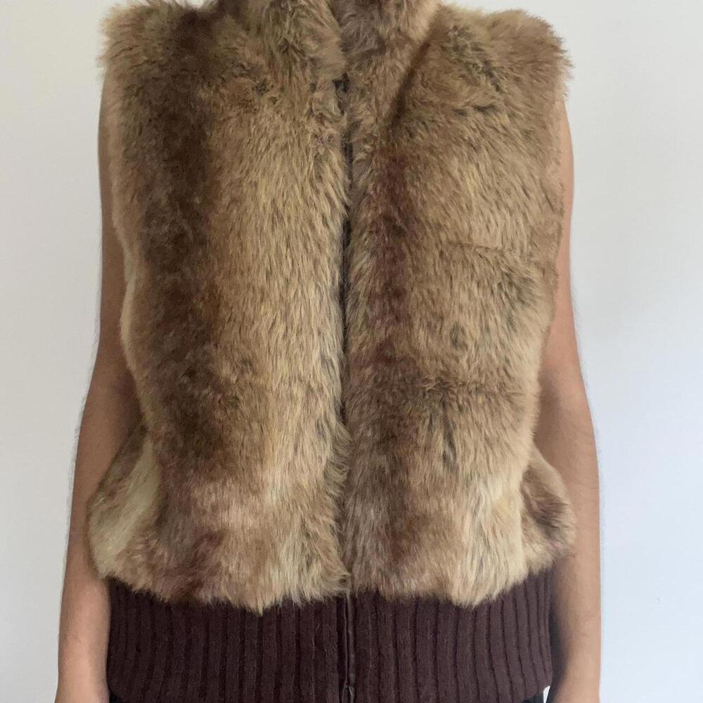 Faux fur vest with a high collar and zipper closure